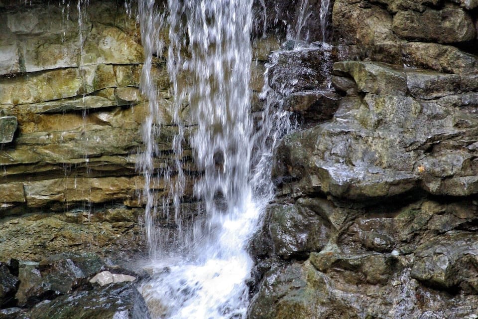 A waterfall cascading over rocky terrain.