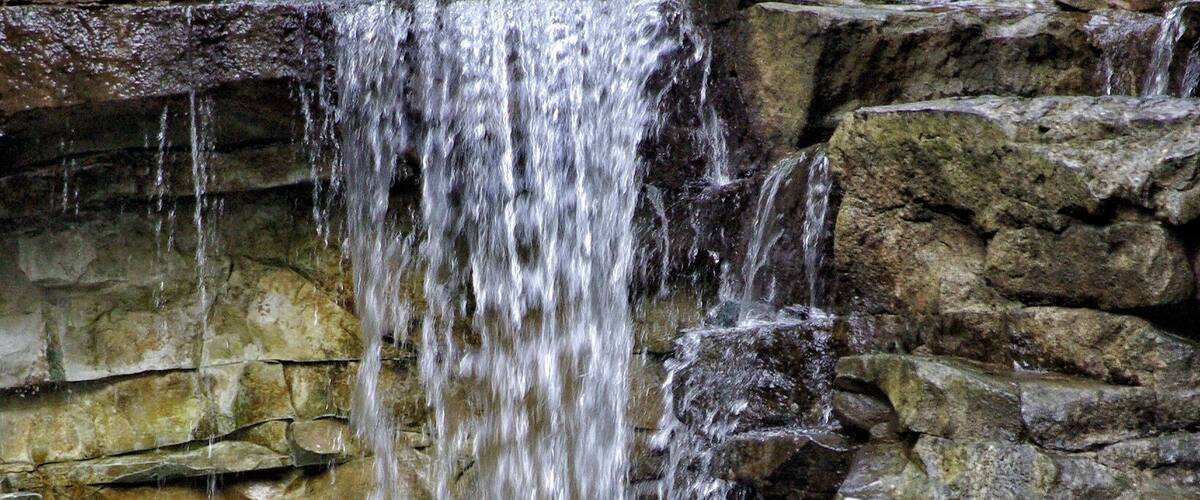 A waterfall cascading over rocky terrain.