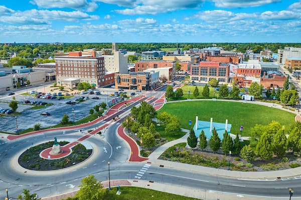 Passing of the Buffalo statue in Muncie city roundabout beside Canan Commons Park aerial, IN