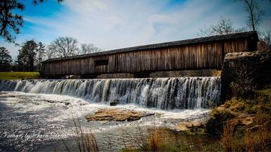 One of the most picturesque state parks in Georgia, Watson Mill Bridge contains the longest covered bridge in the state, spanning 229 feet across the South Fork River. Built in 1885 by Washington (W.W.) King, son of freed slave and famous covered-bridge builder Horace King, the bridge is supported by a town lattice truss system held firmly together with wooden pins. At one time, Georgia had more than 200 covered bridges; today, less than 20 remain