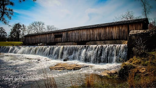 One of the most picturesque state parks in Georgia, Watson Mill Bridge contains the longest covered bridge in the state, spanning 229 feet across the South Fork River. Built in 1885 by Washington (W.W.) King, son of freed slave and famous covered-bridge builder Horace King, the bridge is supported by a town lattice truss system held firmly together with wooden pins. At one time, Georgia had more than 200 covered bridges; today, less than 20 remain