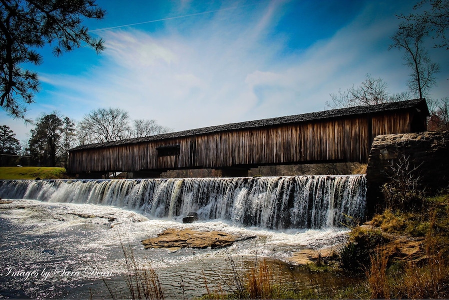 One of the most picturesque state parks in Georgia, Watson Mill Bridge contains the longest covered bridge in the state, spanning 229 feet across the South Fork River. Built in 1885 by Washington (W.W.) King, son of freed slave and famous covered-bridge builder Horace King, the bridge is supported by a town lattice truss system held firmly together with wooden pins. At one time, Georgia had more than 200 covered bridges; today, less than 20 remain