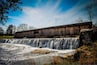 One of the most picturesque state parks in Georgia, Watson Mill Bridge contains the longest covered bridge in the state, spanning 229 feet across the South Fork River. Built in 1885 by Washington (W.W.) King, son of freed slave and famous covered-bridge builder Horace King, the bridge is supported by a town lattice truss system held firmly together with wooden pins. At one time, Georgia had more than 200 covered bridges; today, less than 20 remain