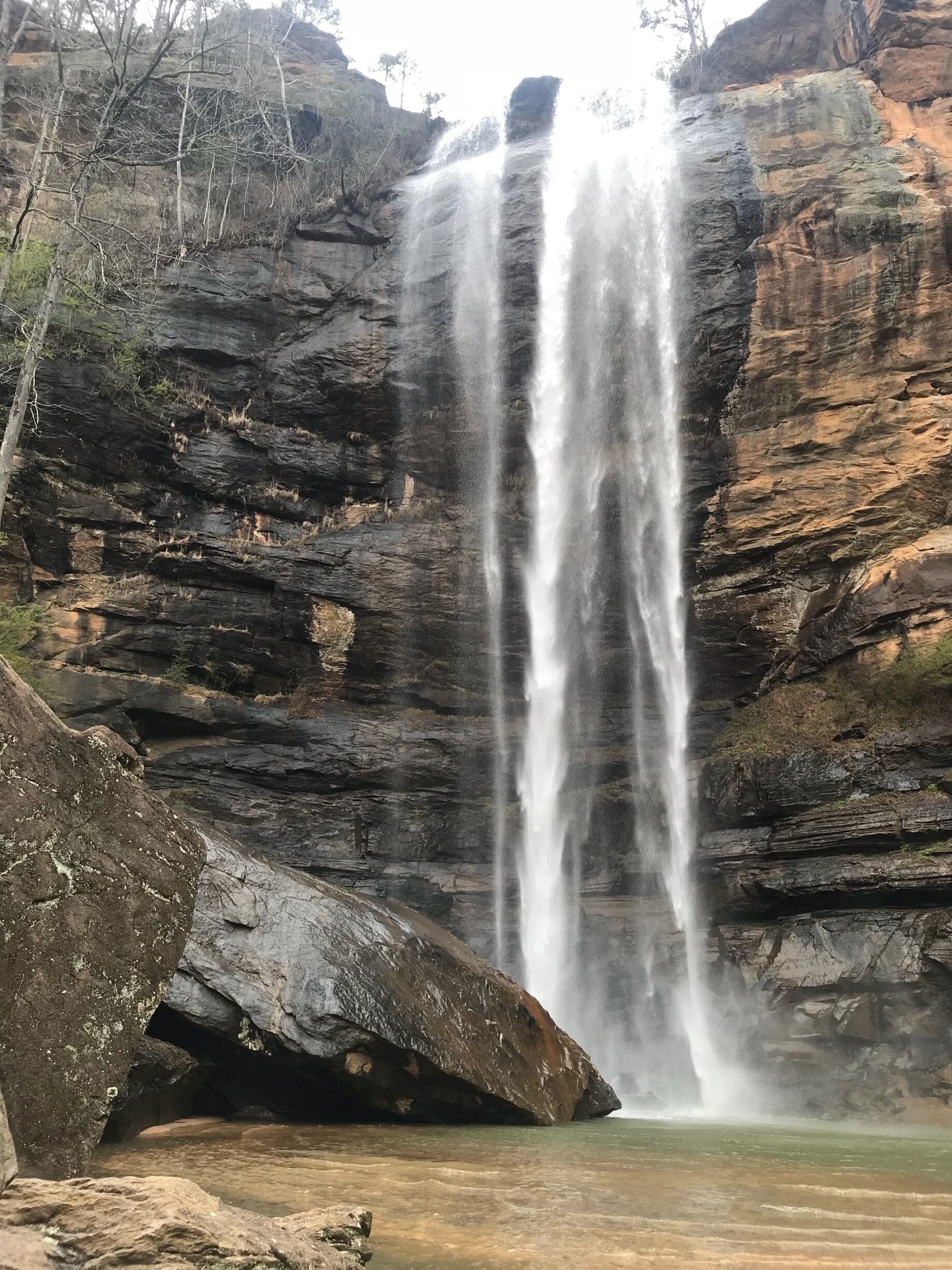 A waterfall cascading down a rocky cliff.