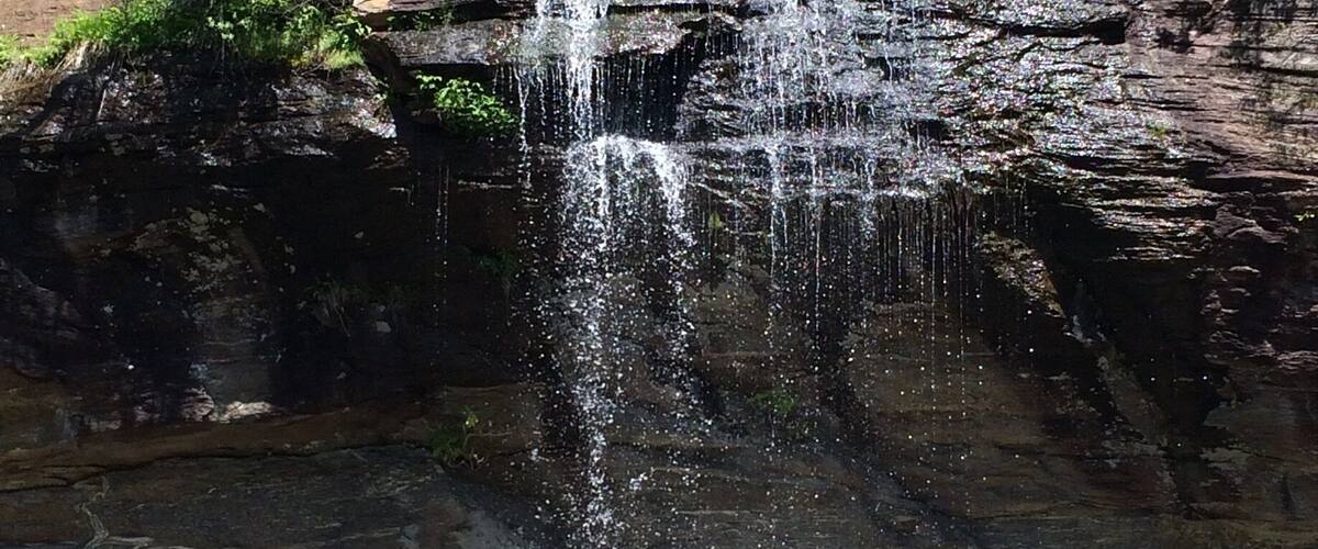 Small, yet lovely roadside waterfall - drive under it! Such a sweet discovery.