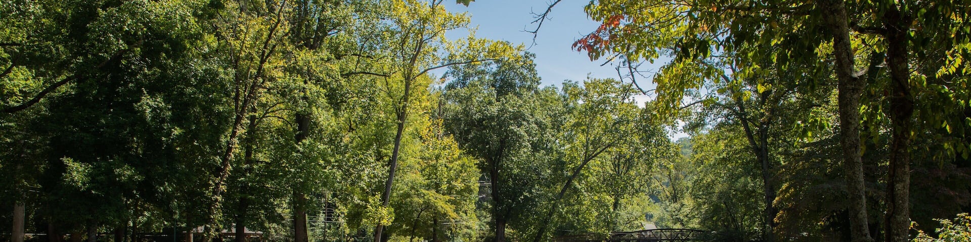 Oconaluftee Islands Park featuring a river or creek