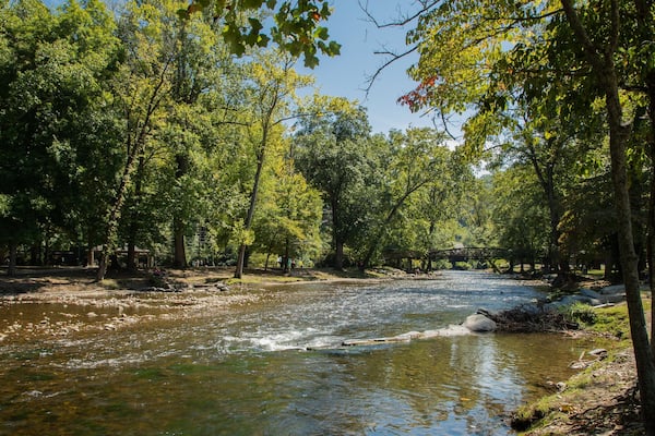 Oconaluftee Islands Park featuring a river or creek