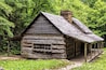 A log cabin in the woods. The Noah Bud Ogle Place was a homestead located in the Great Smoky Mountains Park near Gatlinburg, Tennessee., Shutterstock ID 175219004, Purchase Order: SP-1891 Wave 0, Clie
