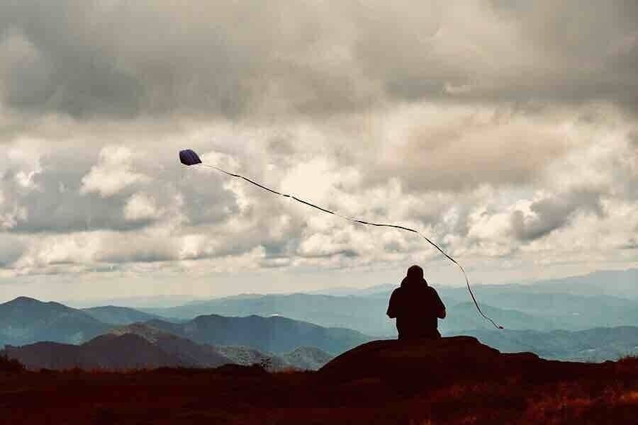 Large bald at the top, takes kite flying to new heights.