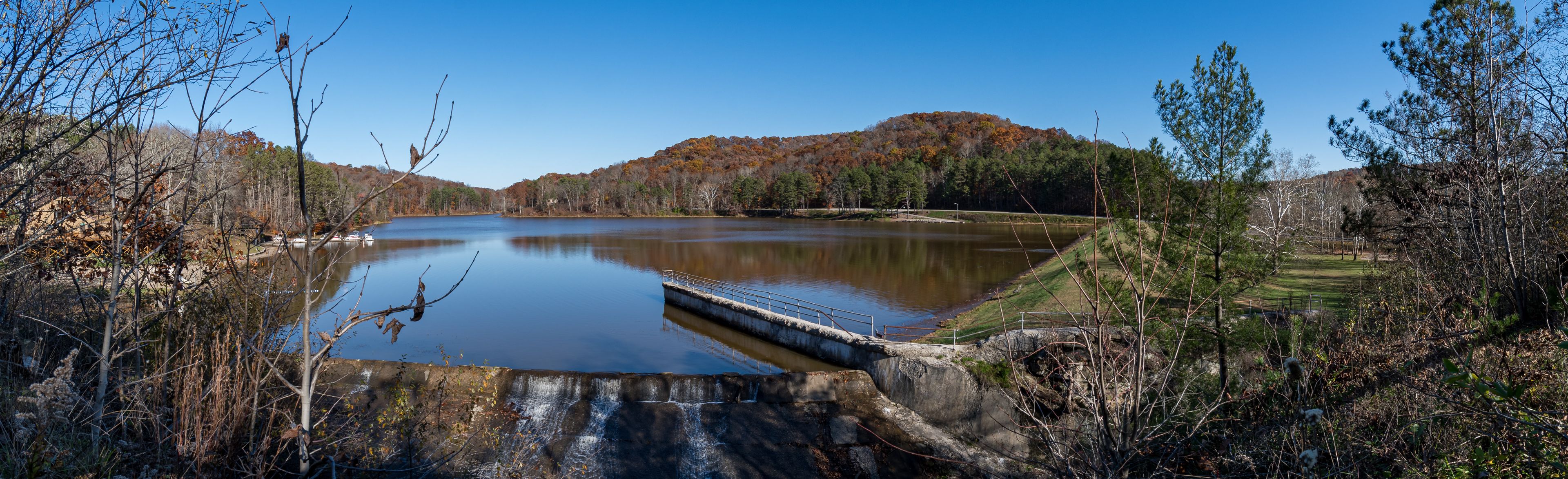 Panorama image of a man-made sport lake in the hill country of Southeast Ohio taken from the down-stream  spillway.