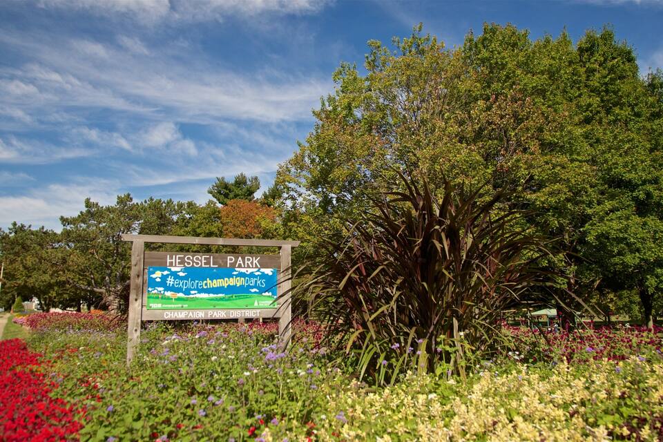 A sign for Hessel Park with a hashtag for exploring Champaign parks.