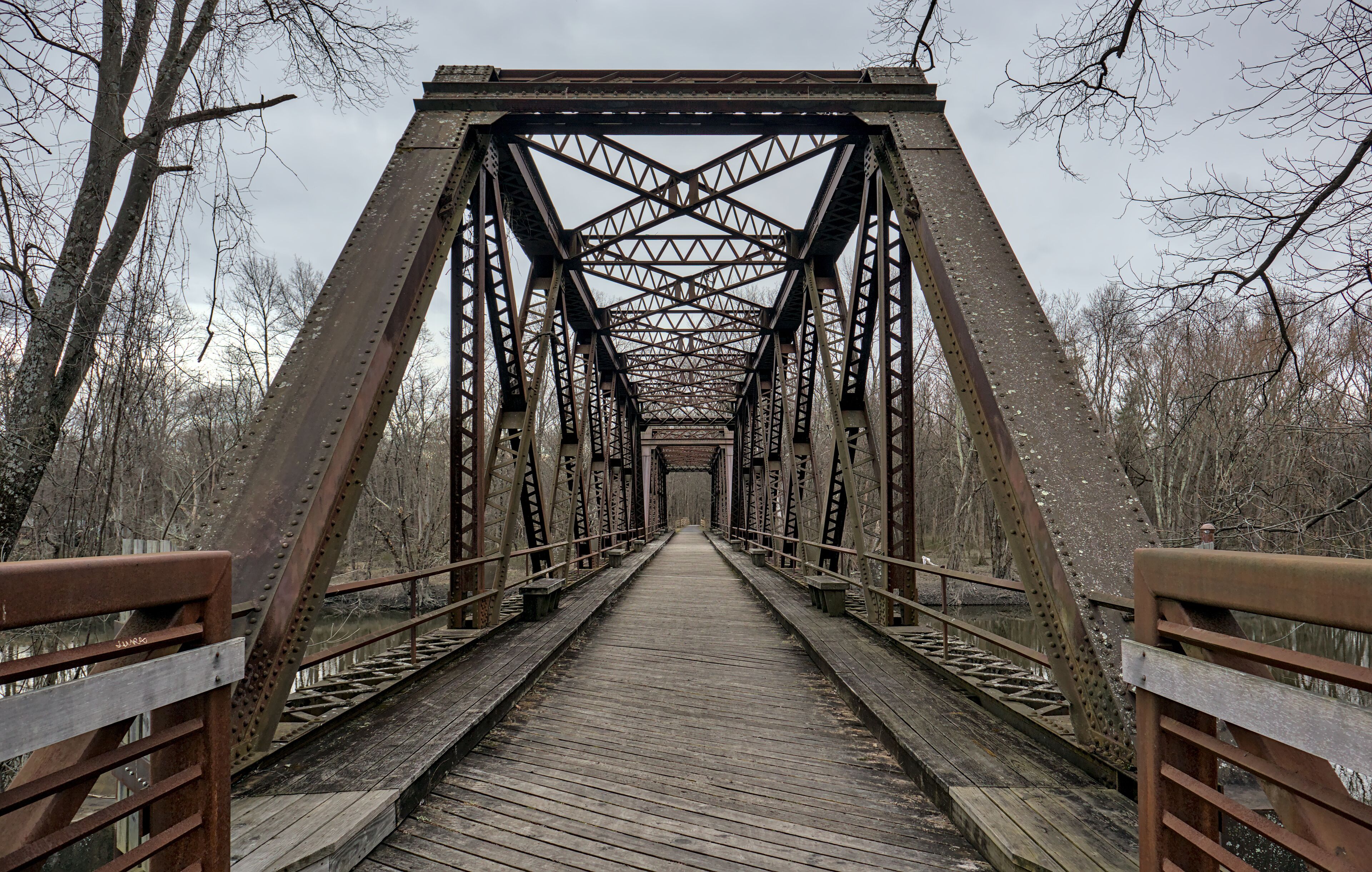 railway trestle bridge over wallkill river valley (springtown bridge in new paltz, new york) iron metal former railroad converted to rail trail and pedestrian path in hudson valley