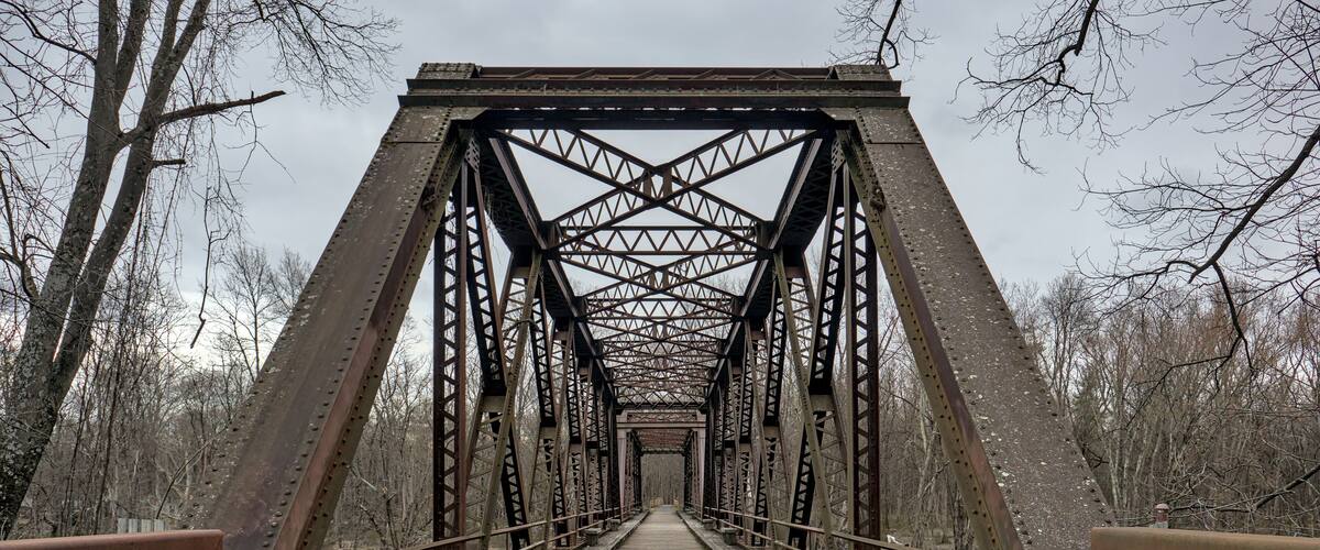 railway trestle bridge over wallkill river valley (springtown bridge in new paltz, new york) iron metal former railroad converted to rail trail and pedestrian path in hudson valley