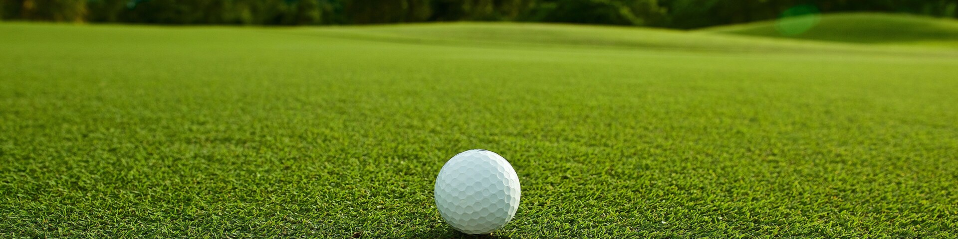 the flare lights photo of white golf ball near hole on fairway w
