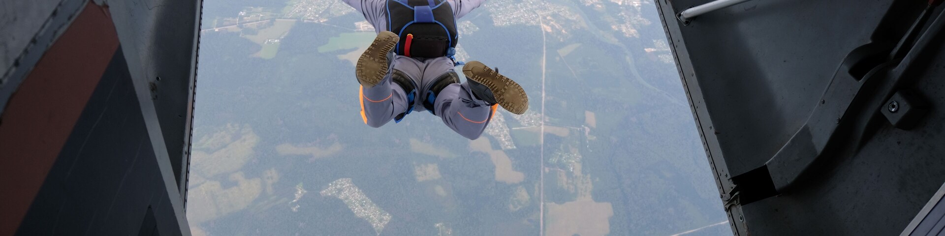 Skydiving. Start jump. A skydiver has just jumped out of a plane into the sky.