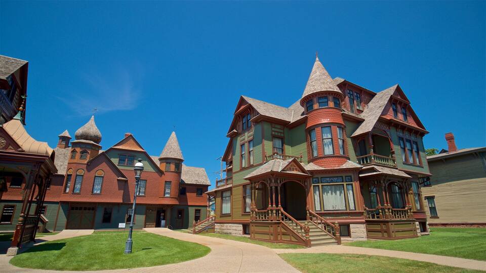 A Victorian-style building with multiple towers and a large porch.