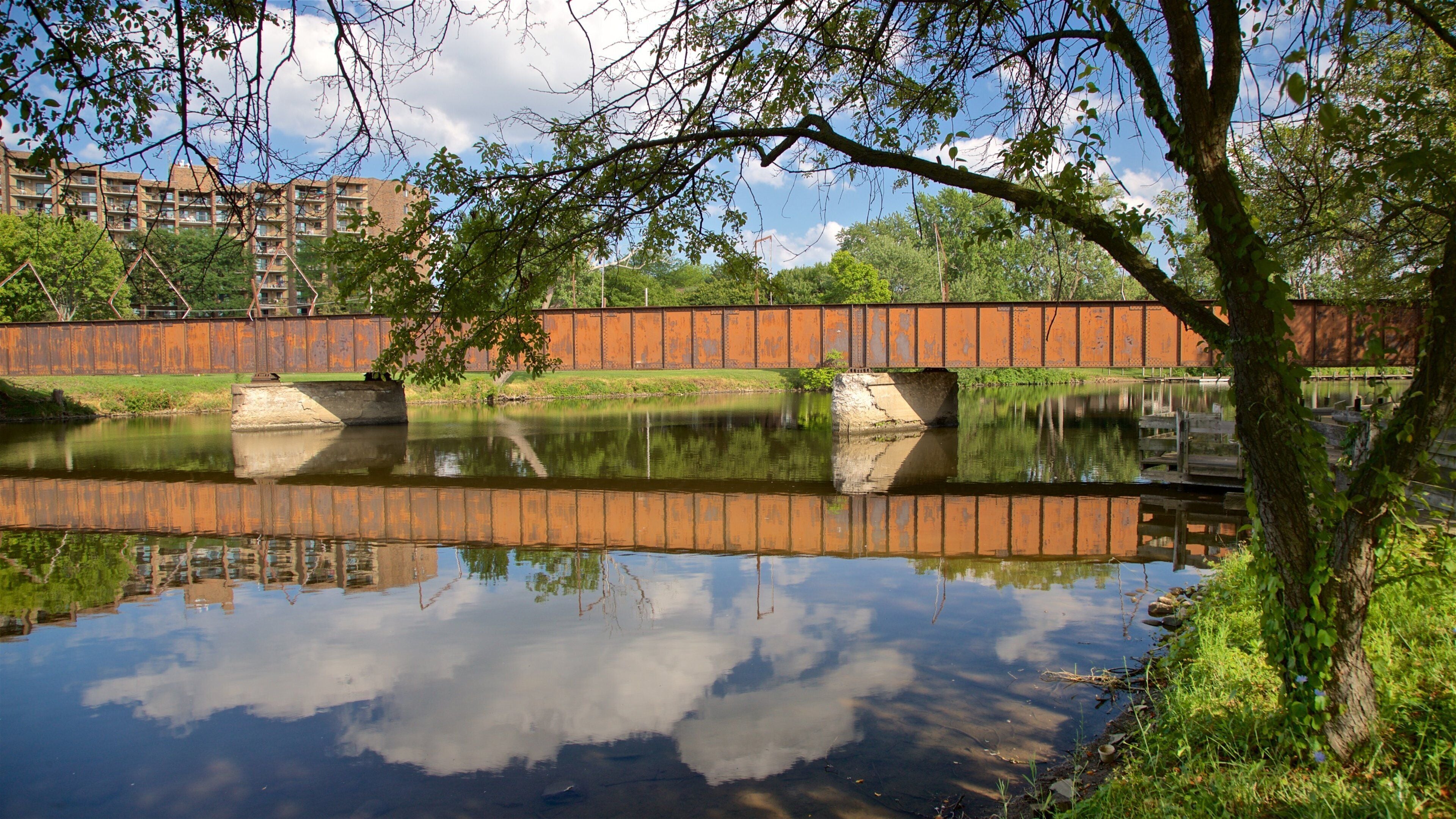 Adado Riverfront Park which includes a river or creek and a bridge