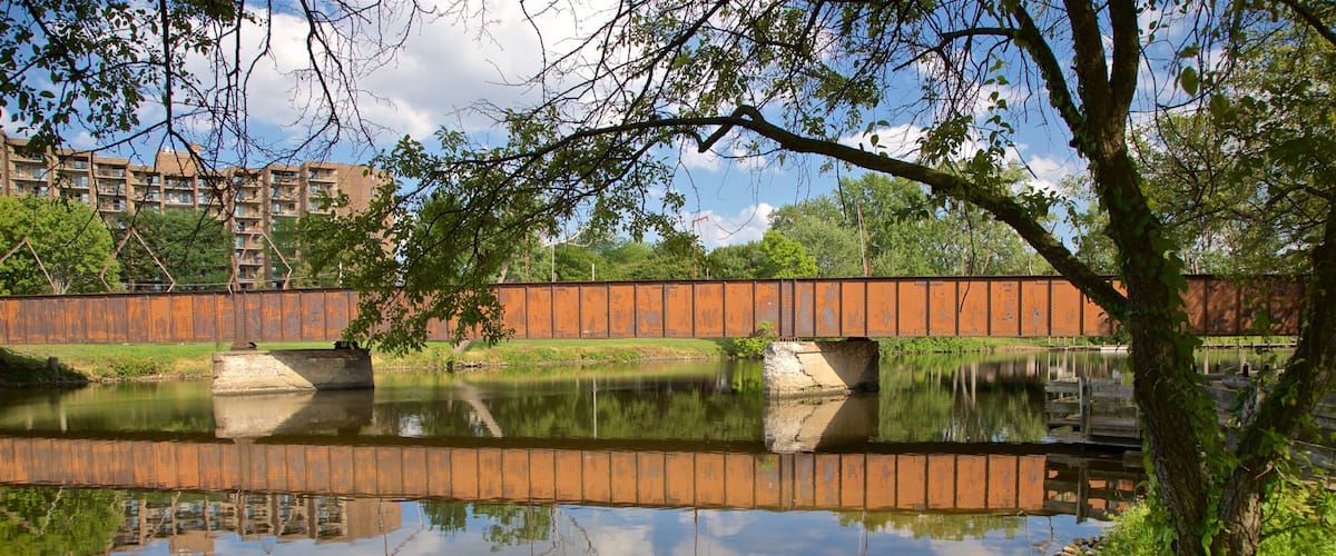 Adado Riverfront Park which includes a river or creek and a bridge