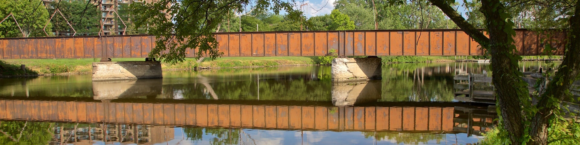 Adado Riverfront Park which includes a river or creek and a bridge