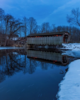 The Fallasburg bridge is part of Fallasburg park and historical villages. There is a little roadside park with a picnic table and little grill. In the summer people load and unload kayaks/canoes or tubes in the river.