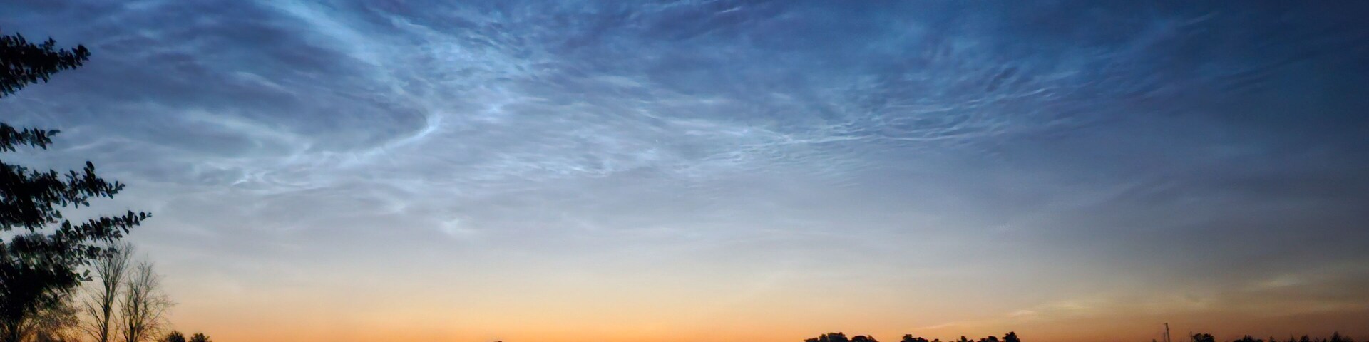 silver clouds shake the lake on a bright summer night