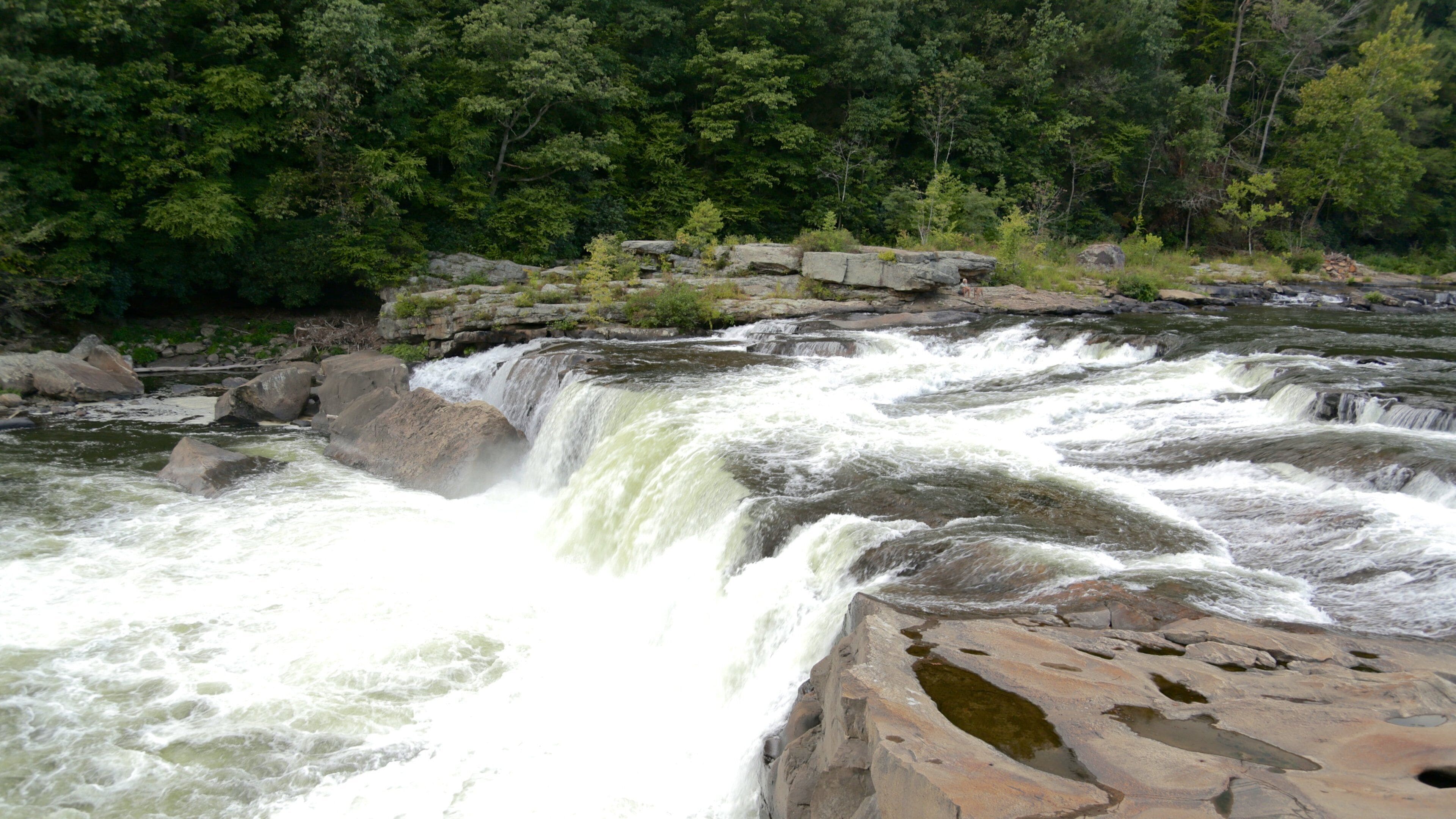 Uniontown which includes rapids and a river or creek