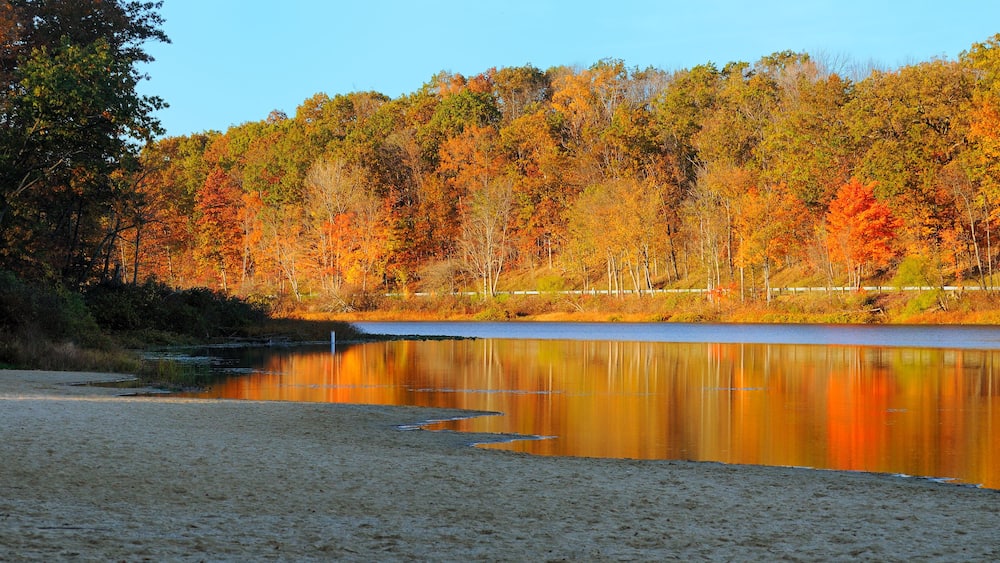 Brilliant autumn colors reflected in a serene lake (Punderson Lake in northeast Ohio)