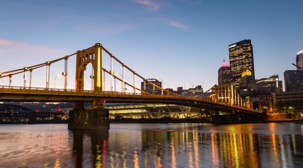 Three Rivers Heritage Trail which includes a bridge, a city and a sunset