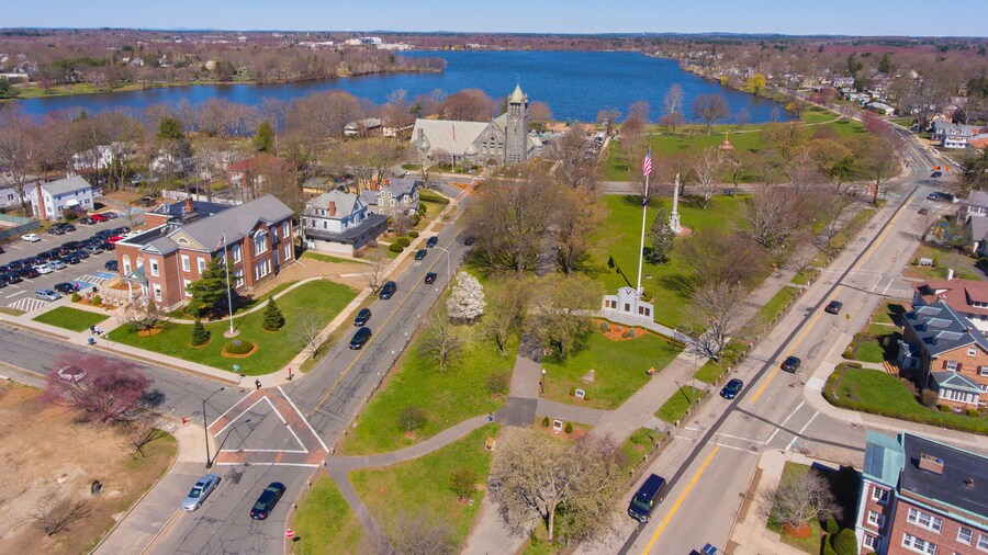 Wakefield historic town center aerial view on town common with Lake Quannapowitt at the back in Wakefield, Massachusetts MA, USA.