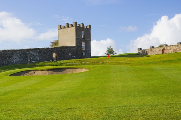 A golf fairway and green in the parkland course in the Roe river valley near Limavady in Northern Ireland