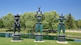 Marshall M. Fredericks Sculpture Museum showing a statue or sculpture, a lake or waterhole and outdoor art