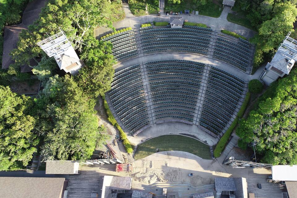 An amphitheater surrounded by trees.