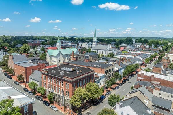 Aerial view Fredericksburg Virginia with Circuit Court building , historic business district, Baptist church, Chatham bridge over Rappahannock River