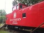 A red Southern Washington train car with the number X518606.