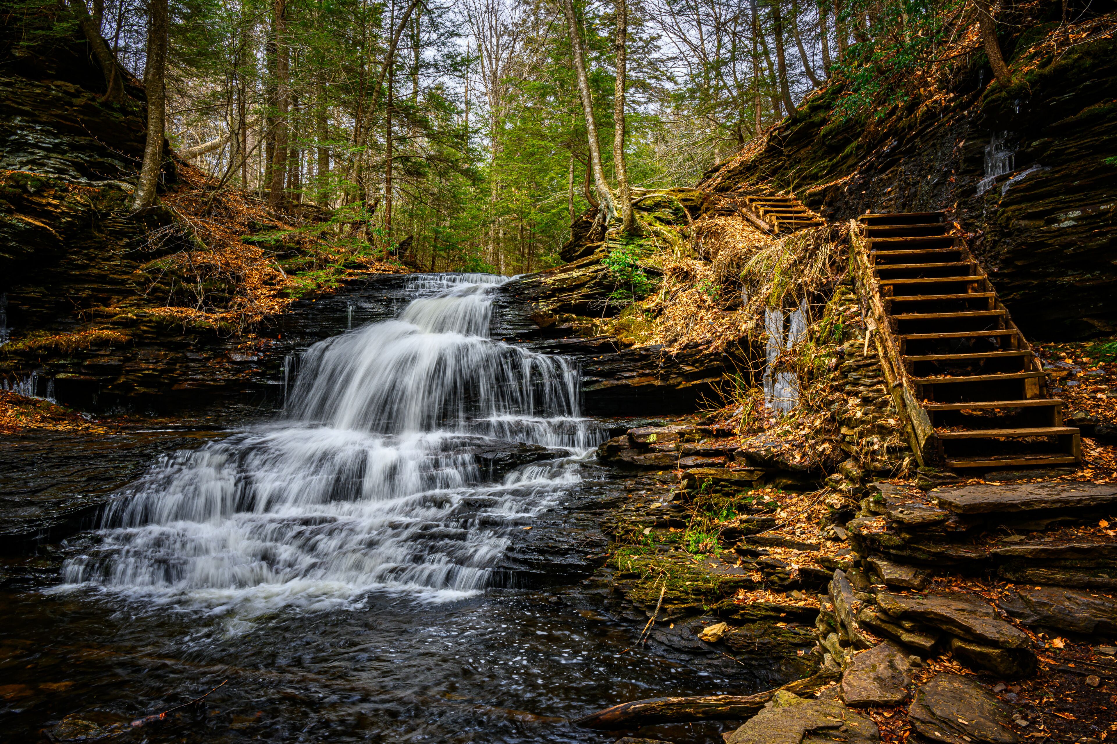Spring at Ricketts Glen State Park in Benton PA. Known for its 21 waterfalls and old-growth forest and boulders. Hiking the loop on a cold Spring Day.
