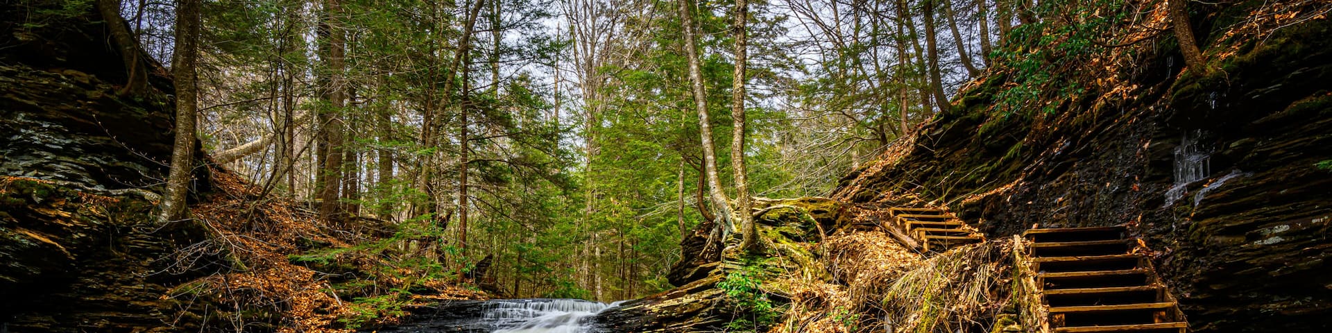 Spring at Ricketts Glen State Park in Benton PA. Known for its 21 waterfalls and old-growth forest and boulders. Hiking the loop on a cold Spring Day.