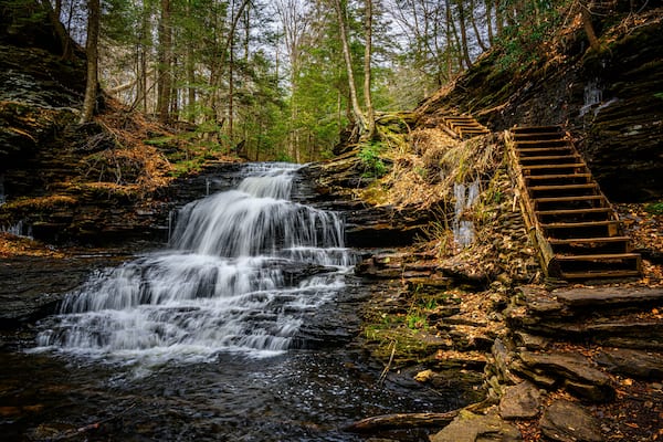 Spring at Ricketts Glen State Park in Benton PA. Known for its 21 waterfalls and old-growth forest and boulders. Hiking the loop on a cold Spring Day.