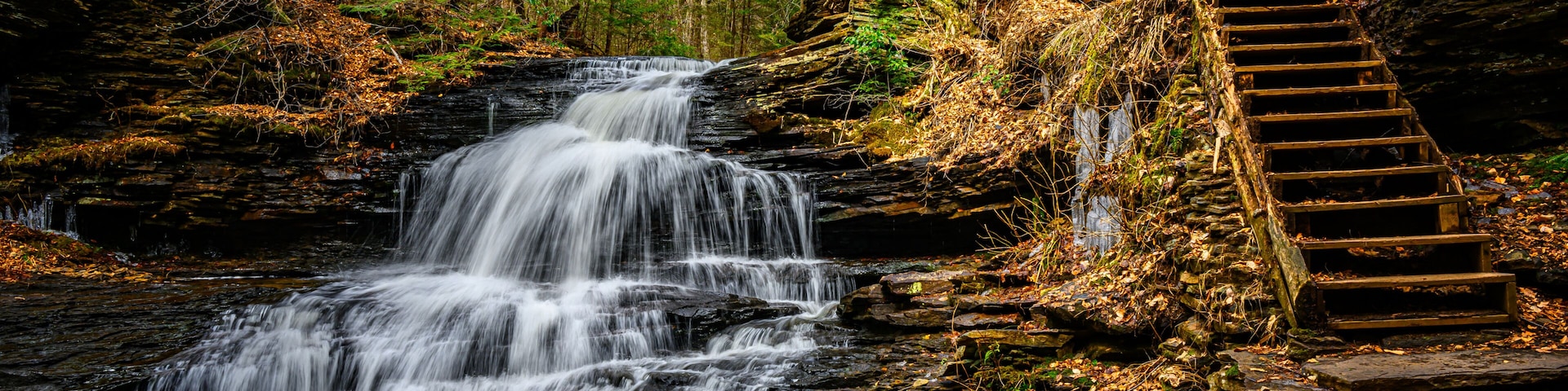 Spring at Ricketts Glen State Park in Benton PA. Known for its 21 waterfalls and old-growth forest and boulders. Hiking the loop on a cold Spring Day.