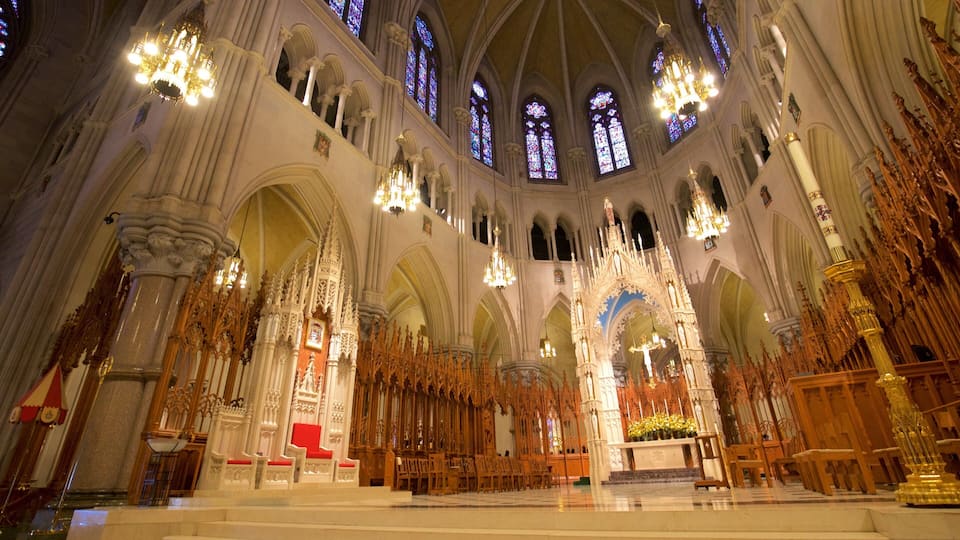 A grand cathedral interior with ornate Gothic architecture, stained glass windows, and a central altar.