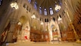 A grand cathedral interior with ornate Gothic architecture, stained glass windows, and a central altar.