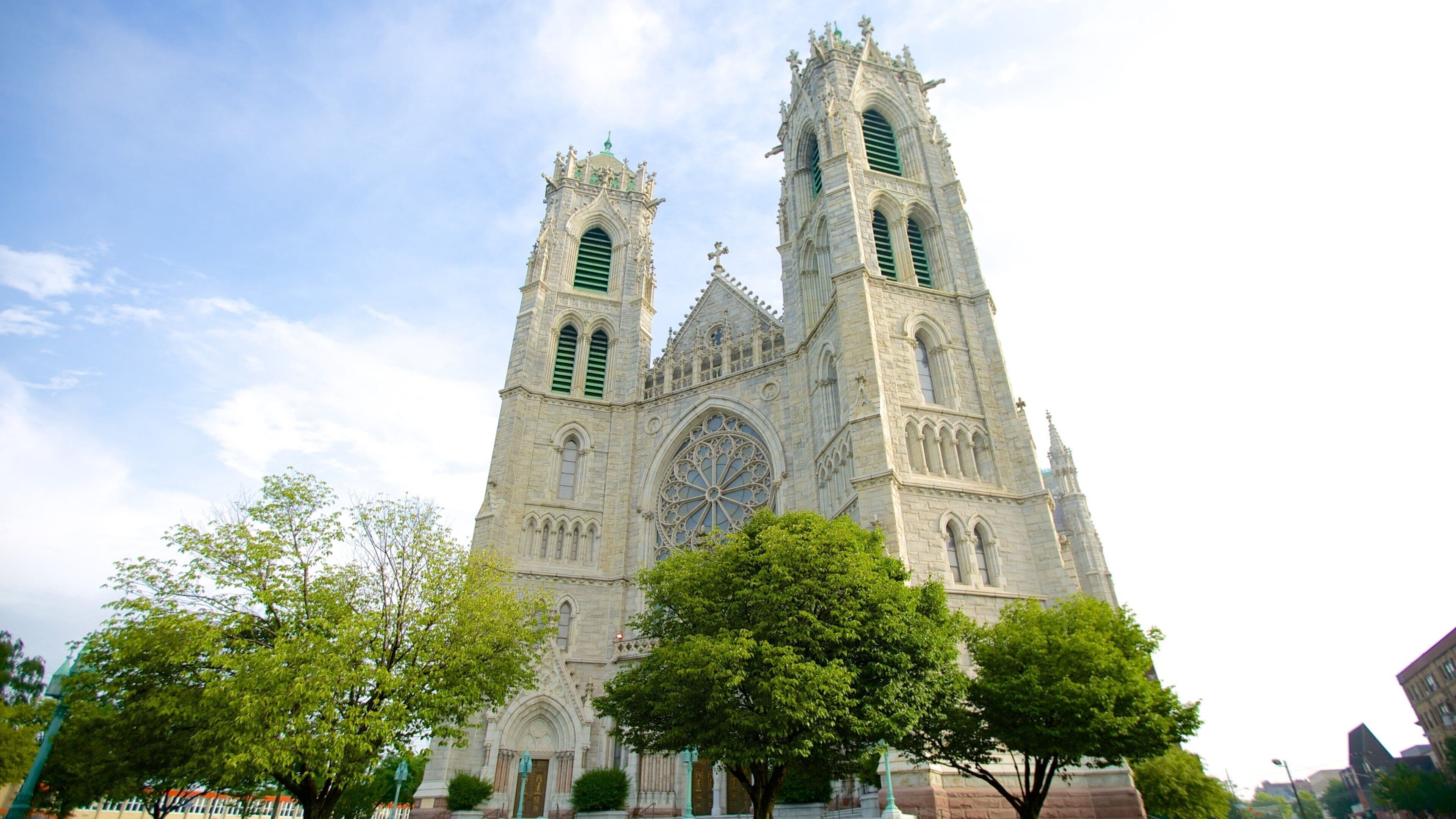 A large Gothic-style cathedral with twin towers and a large rose window.