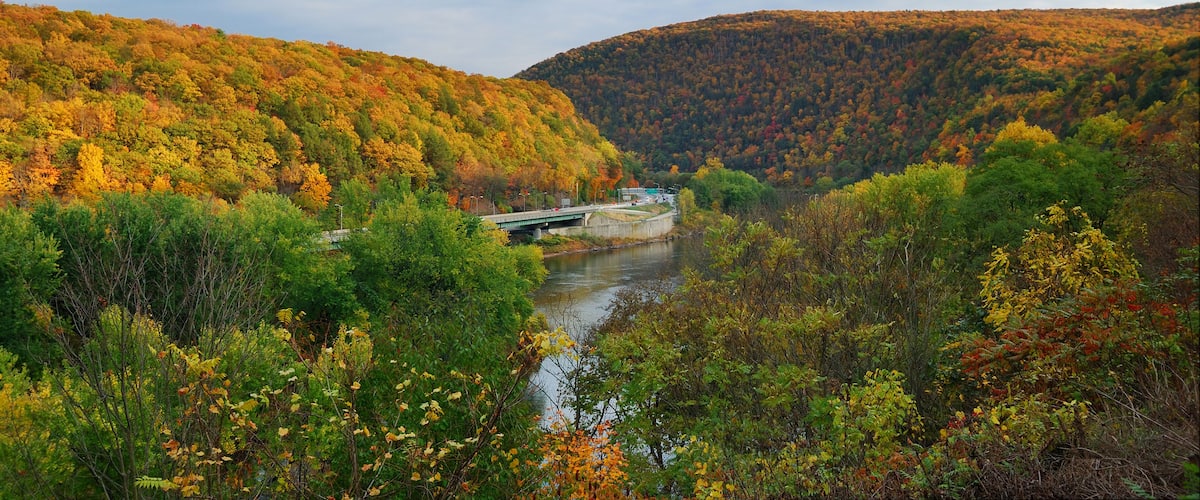 Delaware Water Gap panorama in Autumn with colorful foliage with forest and mountain over river