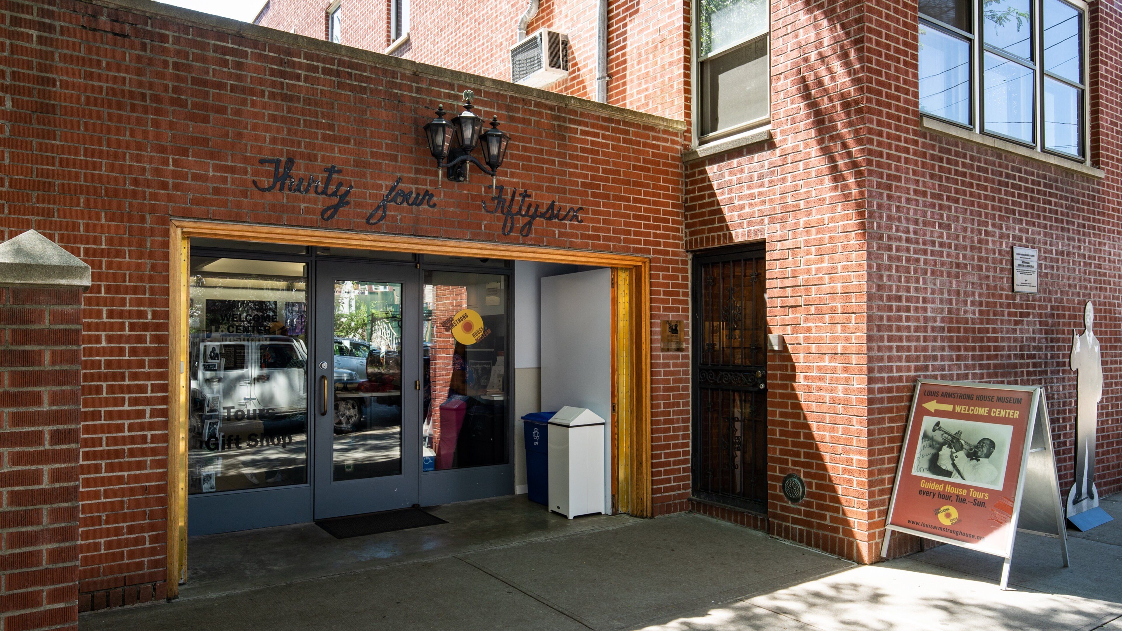 Louis Armstrong House featuring signage