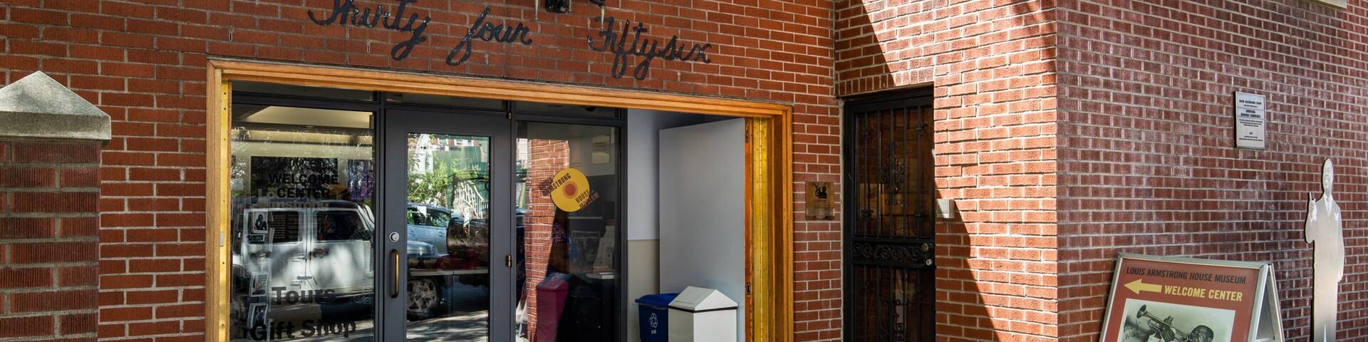 Louis Armstrong House featuring signage