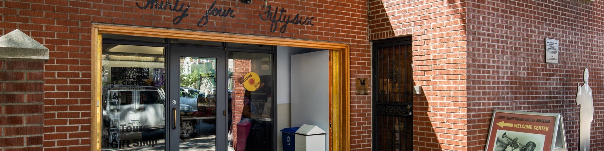 Louis Armstrong House featuring signage