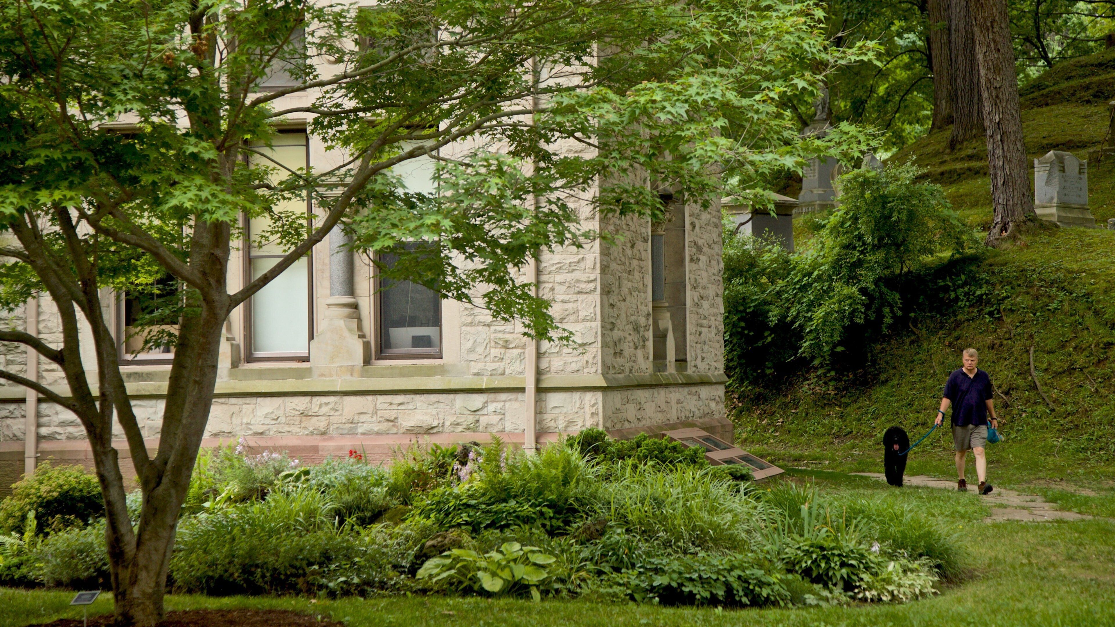 Mount Hope Cemetery featuring cuddly or friendly animals, a garden and hiking or walking