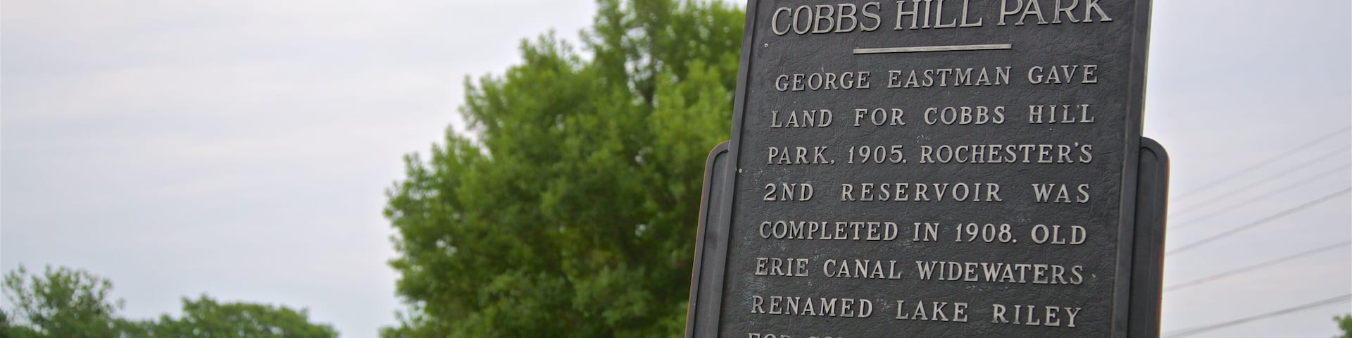 A sign for Cobbs Hill Park with historical information.