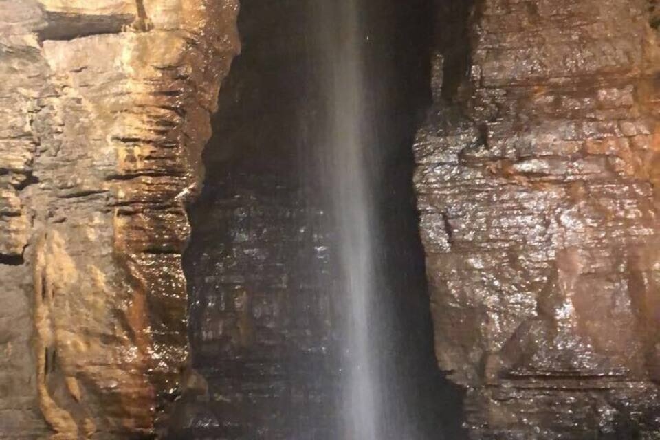 A cave with a waterfall.