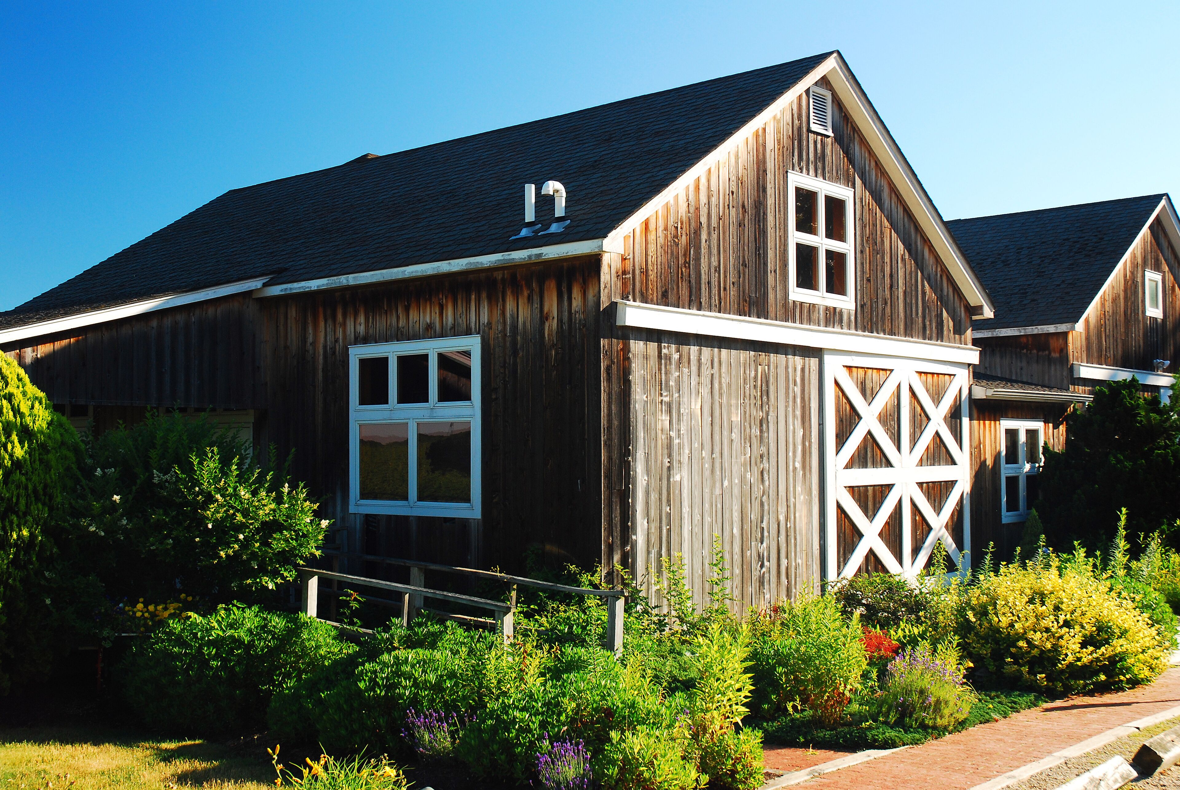 A summer garden blooms at a rustic barn in a winery in Jamesport Long Island