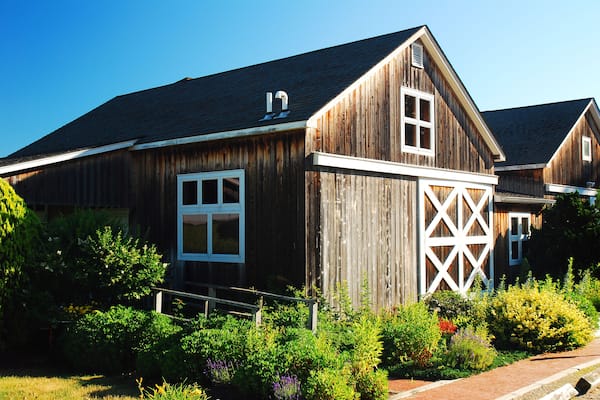 A summer garden blooms at a rustic barn in a winery in Jamesport Long Island